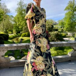 Luxurious peonies on a summer evening, a long cotton dress